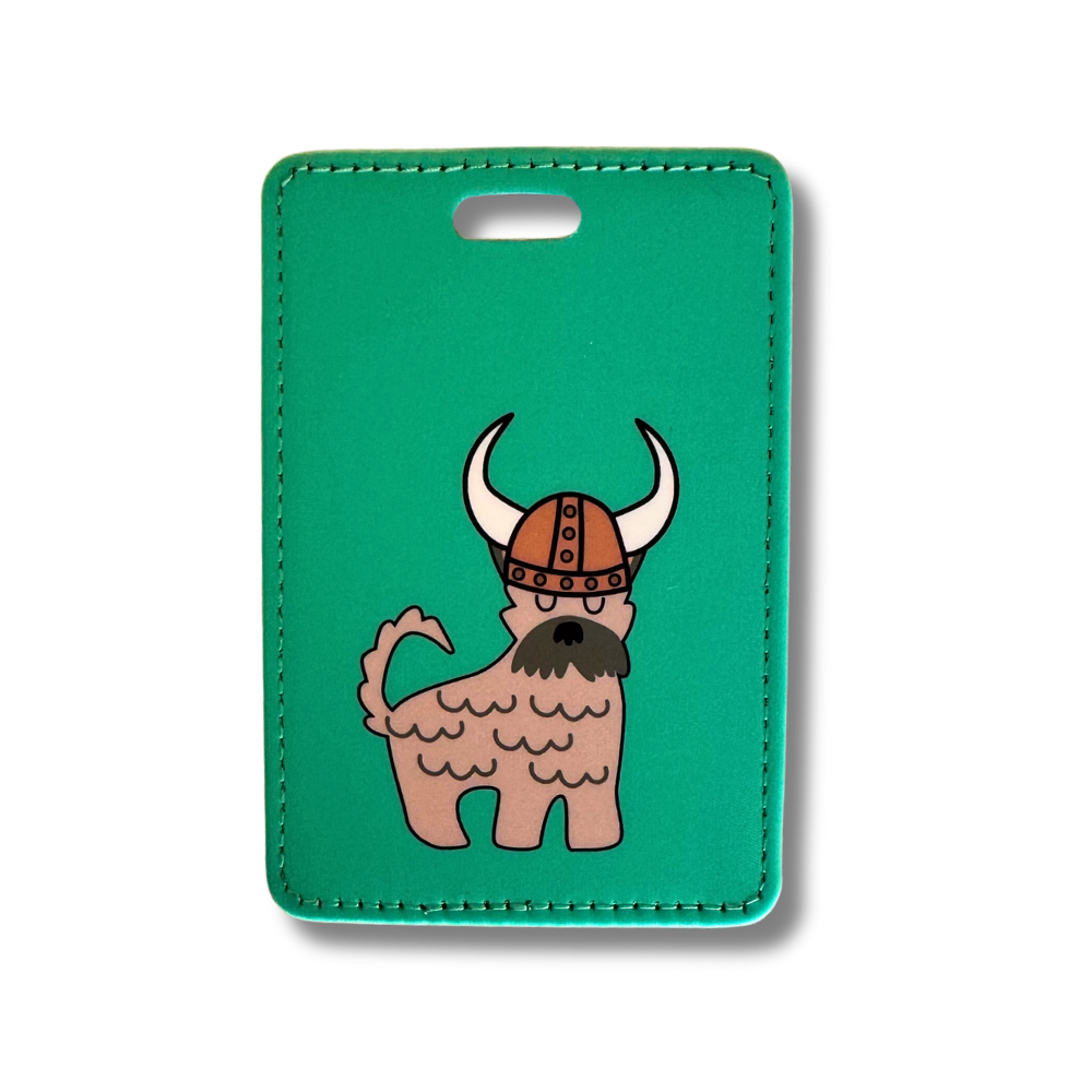 Green background with tan schnauzer dog wearing a Viking hat / dog luggage tag.