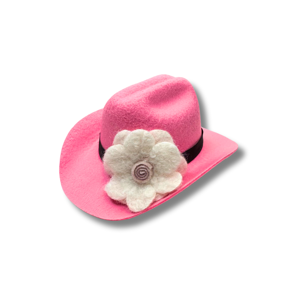 mini pink dog cowboy hat with white wool felt flower. Shown at an angle so the flower is in full view.