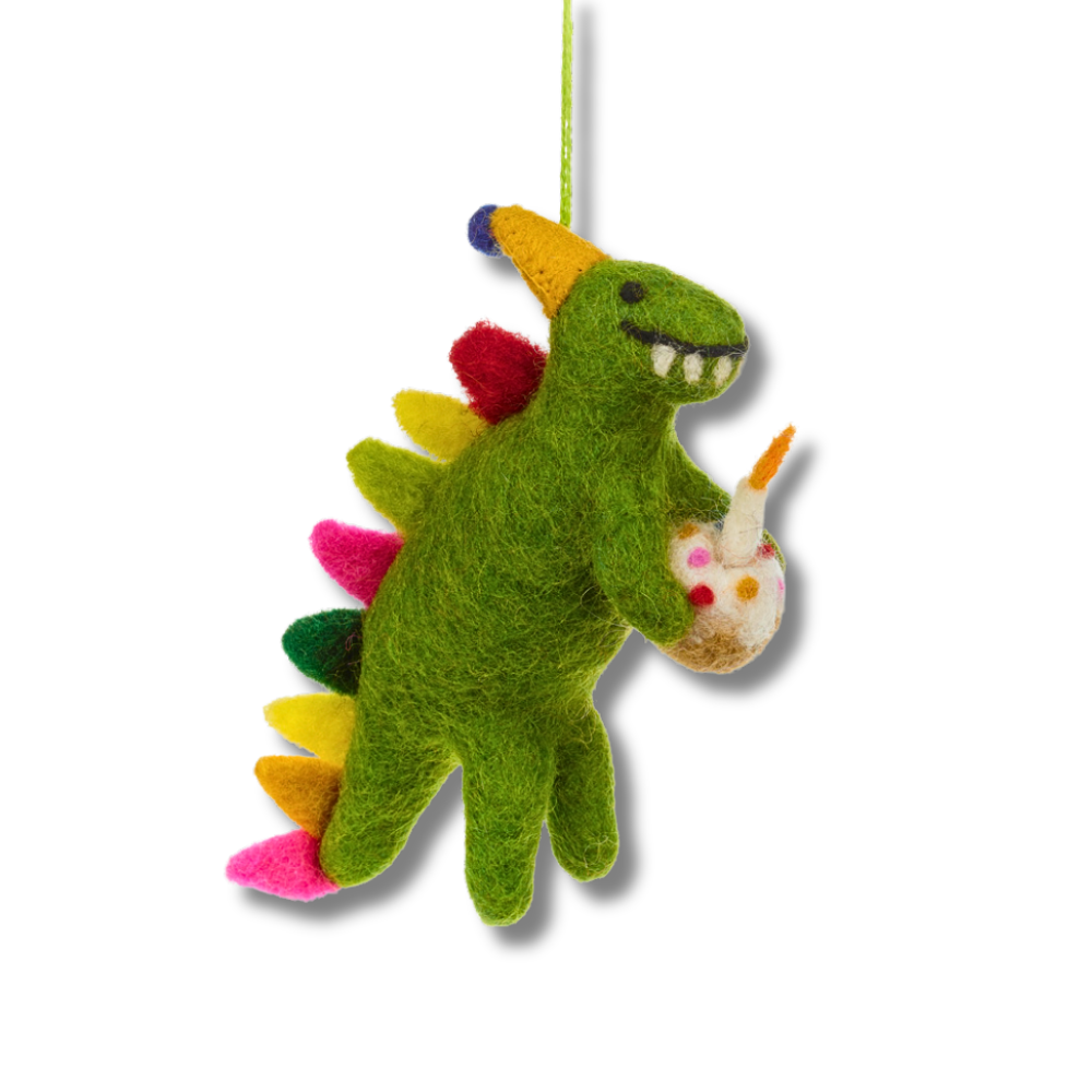 Green felt birthday dinosaur party decoration. Dino is holding a birthday cake with a felt candle. The dinosaur has colorful spikes on their back.