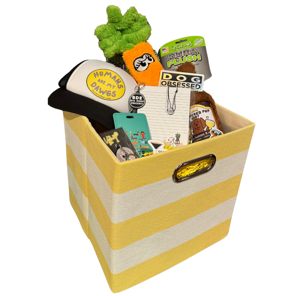 Yellow and white striped dog and owner Easter basket filled with custom dog hat, toys, stickers, bracelet, keychain, and more.