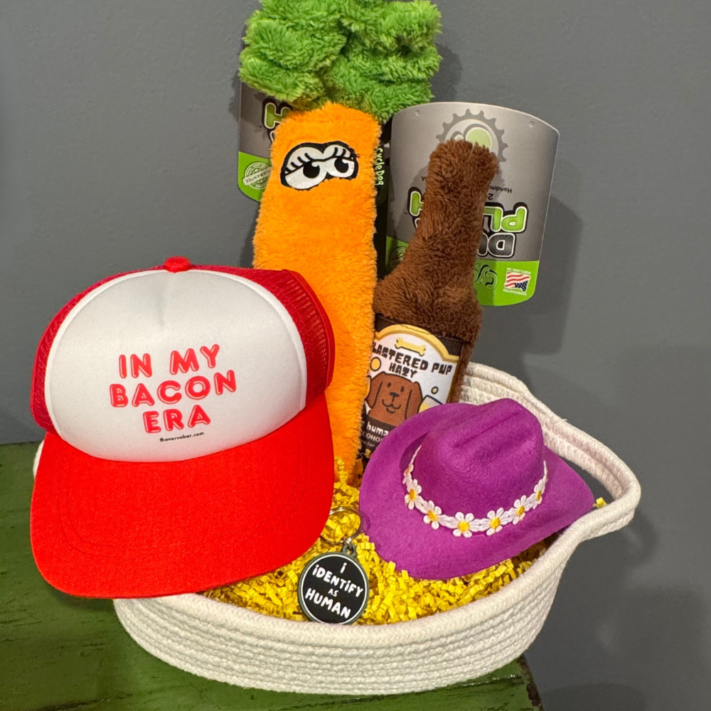 cotton rope dog easter basket with a dog baseball hat, a dog cowboy hat, a collar charm and two plush dog toys (carrot and beer bottle)