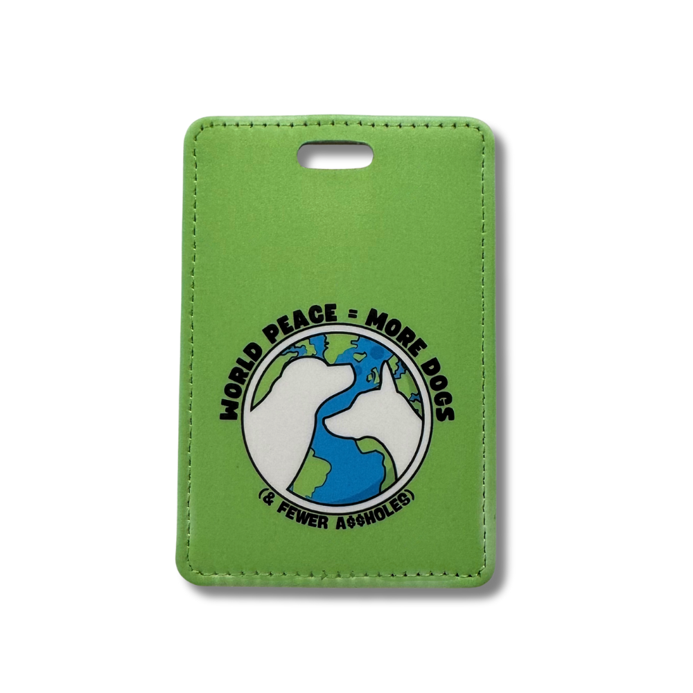 green luggage tag with a globe and two white dog silhouettes; world peace = more dogs and fewer assholes