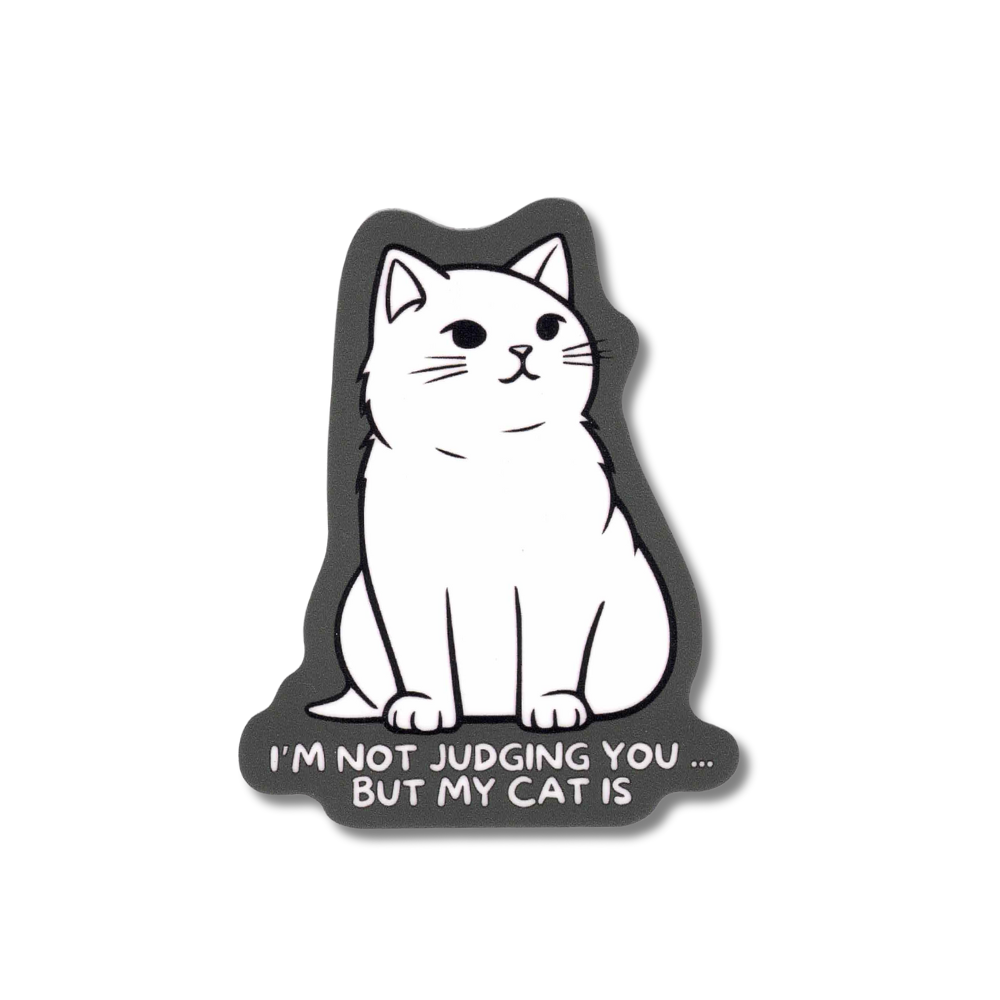 Cat sticker. White cartoon cat with gray background "I'm not judging you but my cat is."