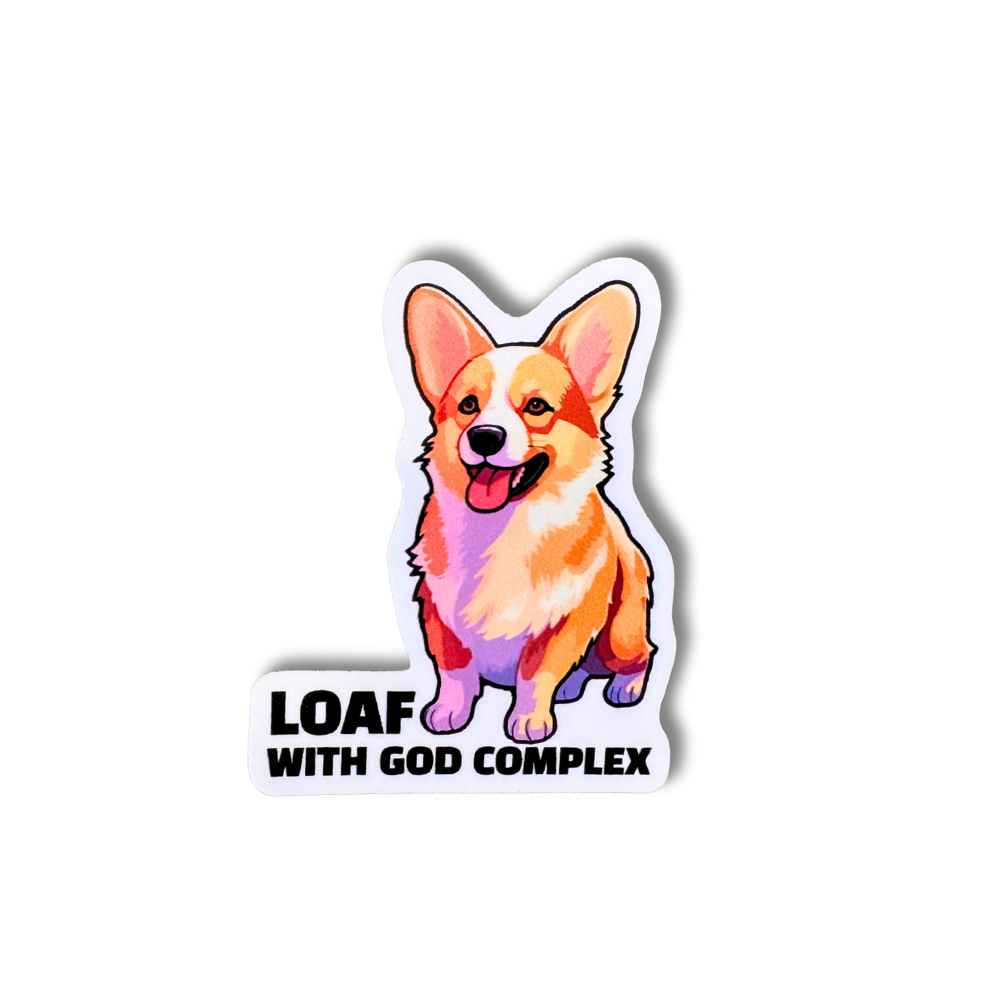 Funny corgi vinyl sticker with orange and pink tones and bold text “Loaf With God Complex”