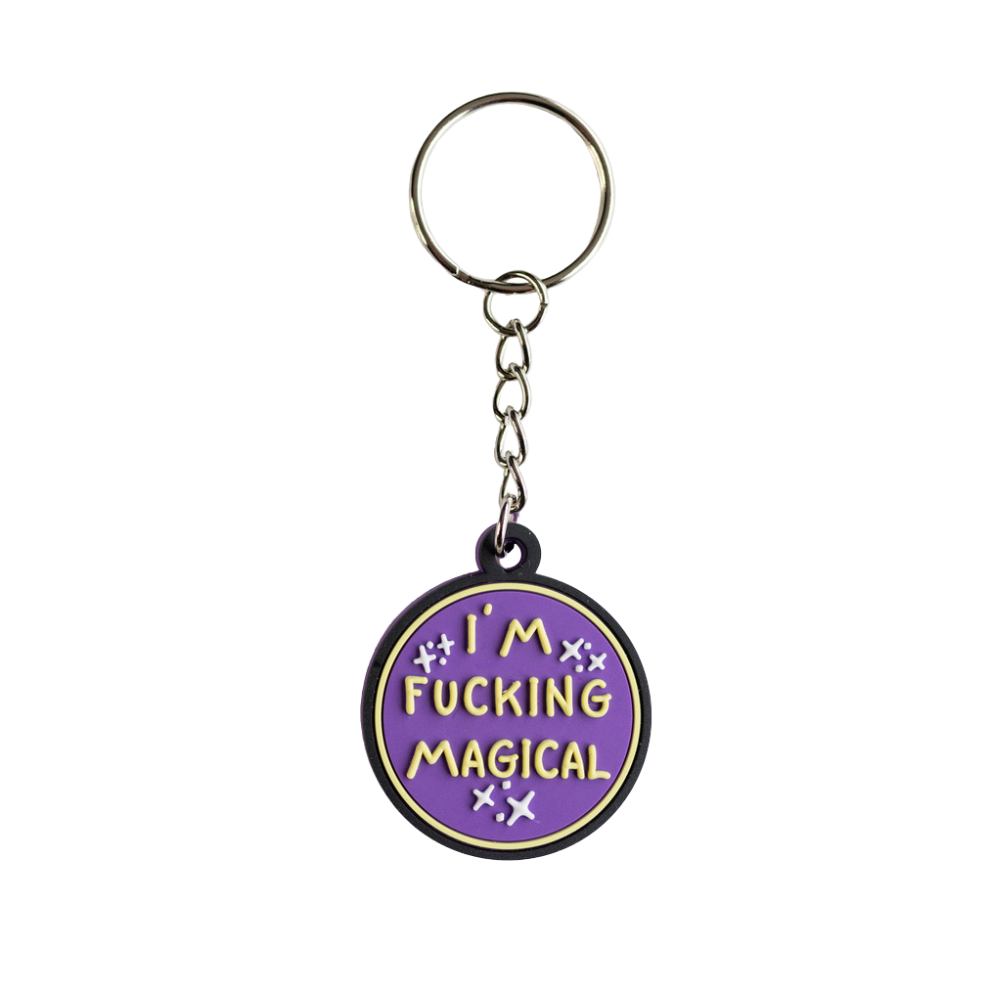 Funny purple keychain with raised yellow letters that says I'm F*cking Magical. Full view