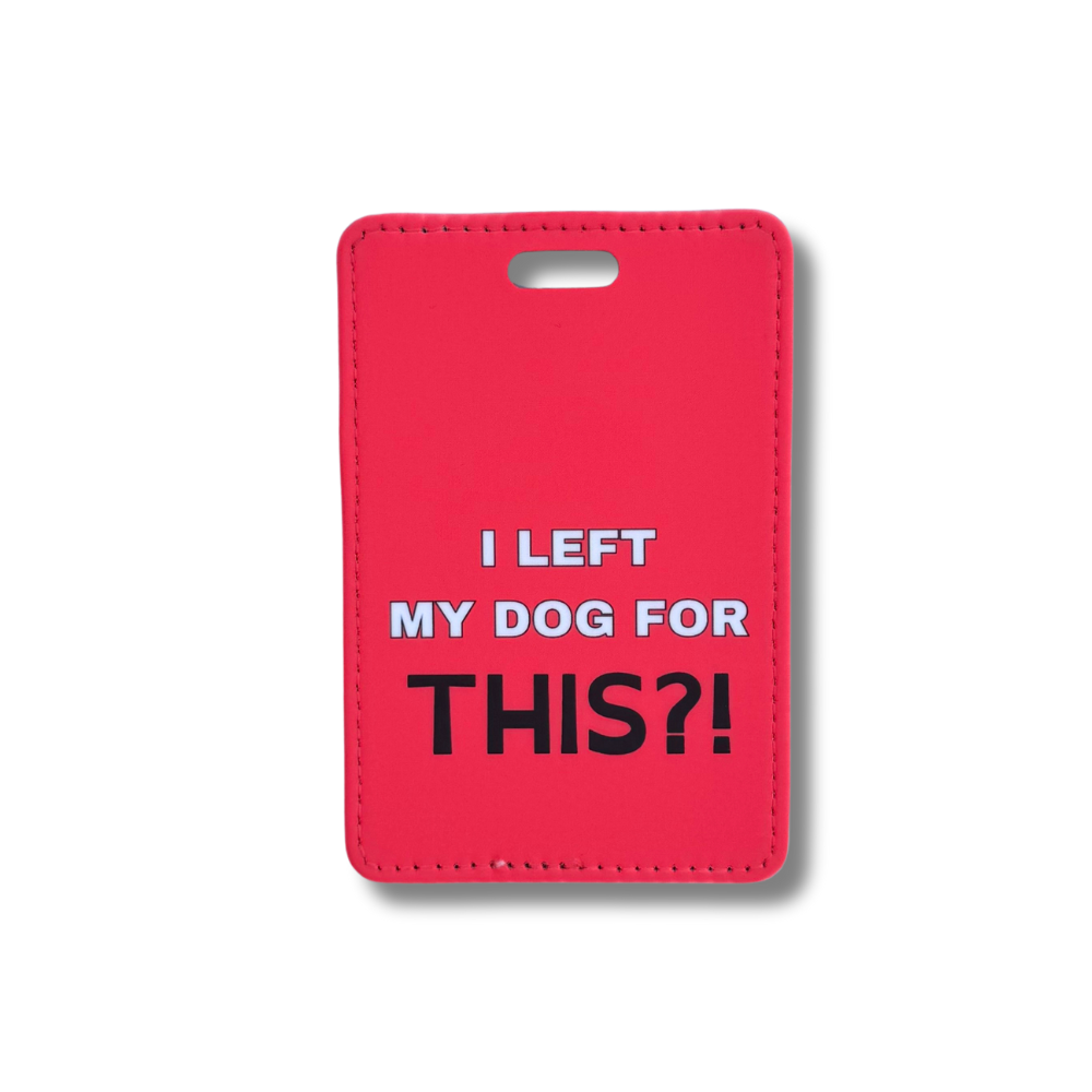 Red faux leather luggage tag with "I left my dog for THIS?!" printed in bold text. A funny travel accessory for dog lovers with separation anxiety.