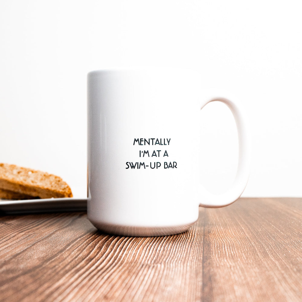 funny office mug. Minimalist style, white mug with small black text "mentally I"m a swim-up bar"