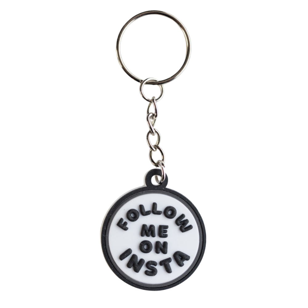 gift for influencer: white keychain with raised letters "follow me on Insta"