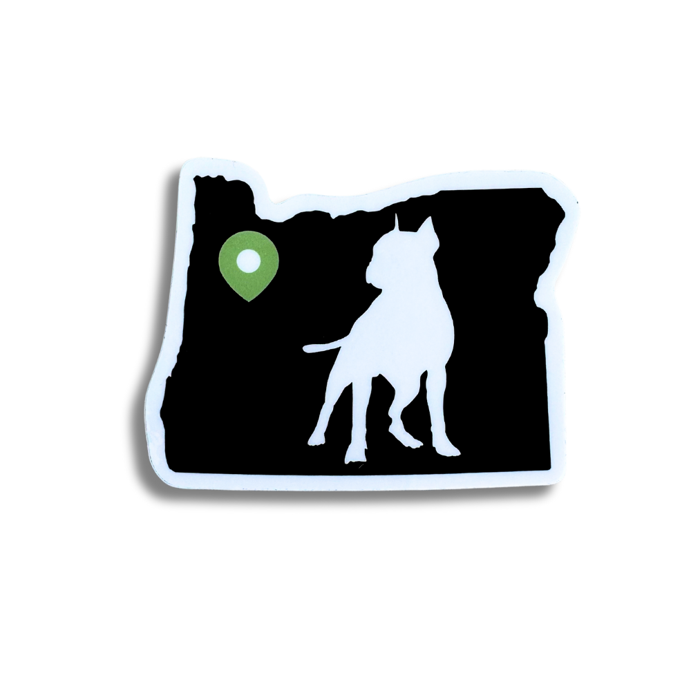 sticker: shape of oregon in black with a green location pin near Portland. Silhouette of pit bull dog