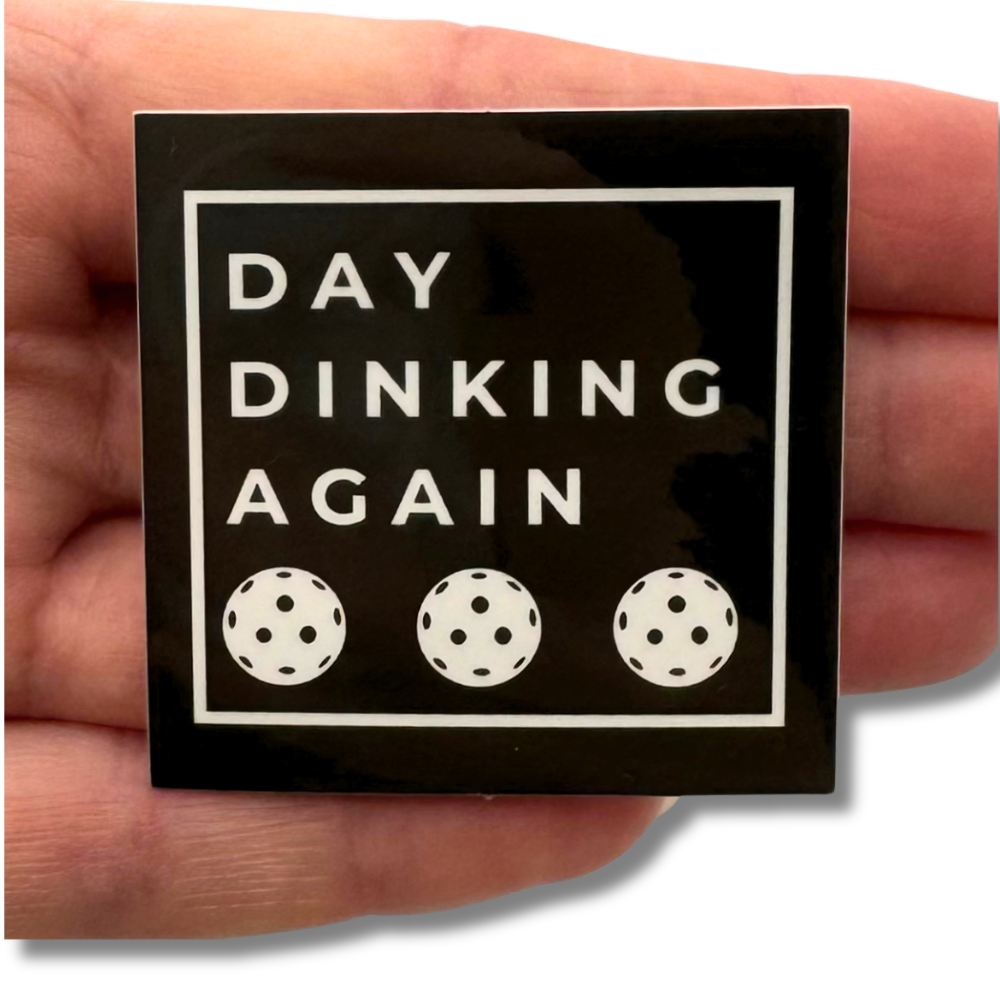 hand holding dark brown Pickleball sticker to show size