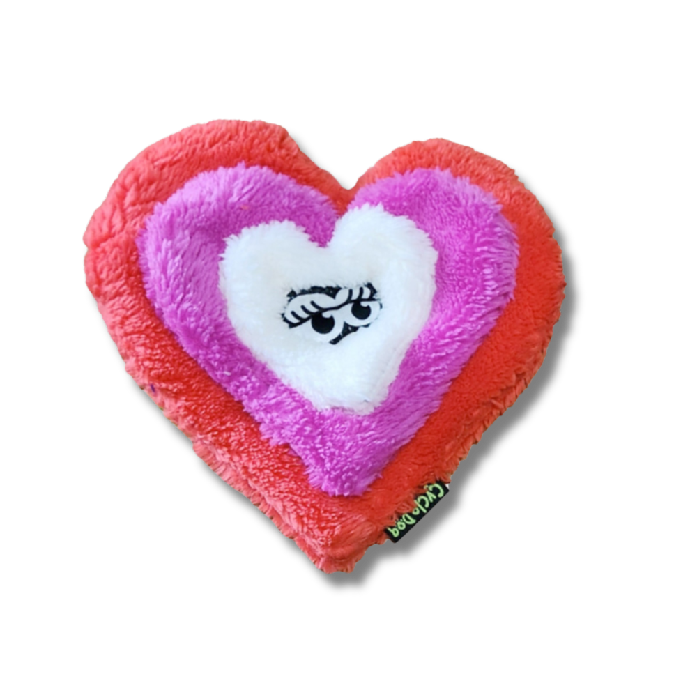 PLUSH DOG TOY SHAPED LIKE A HEART WITH 3 LAYERS; RED, PINK, WHITE. EYES IN THE MIDDLE