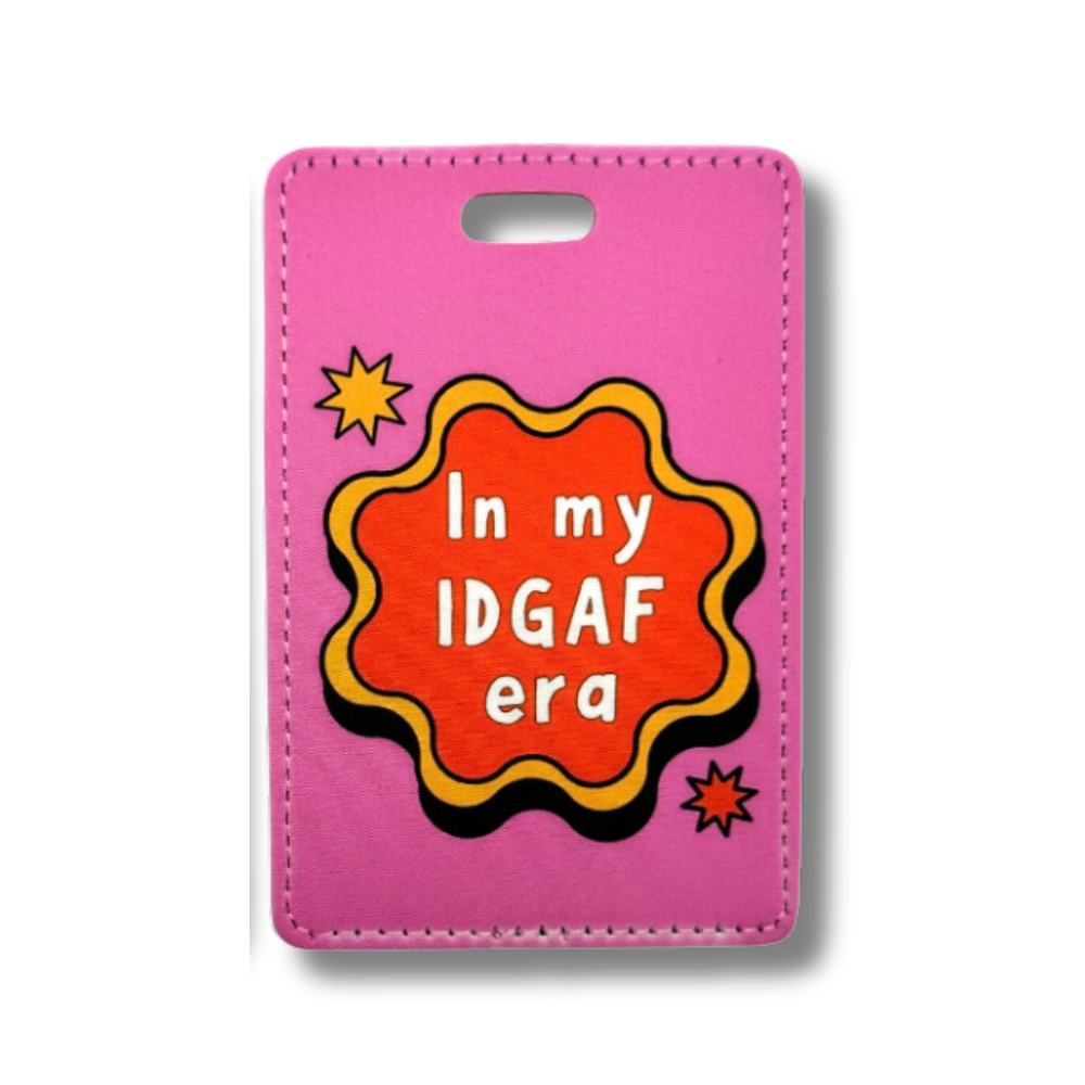 funny travel luggage tag "In my IDGAF era" hot pink with yellow and red retro wavy circle shape and white letters.
