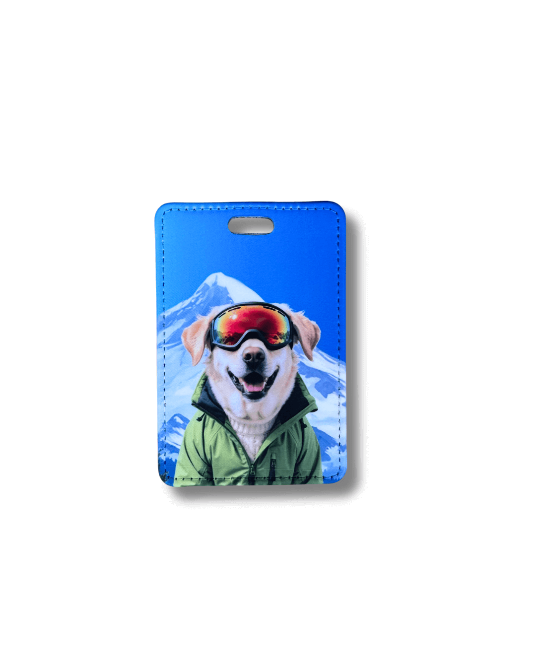 yellow lab ski luggage tag; yellow Labrador wearing ski goggles and green jacket with snowy mountain background on blue travel tag