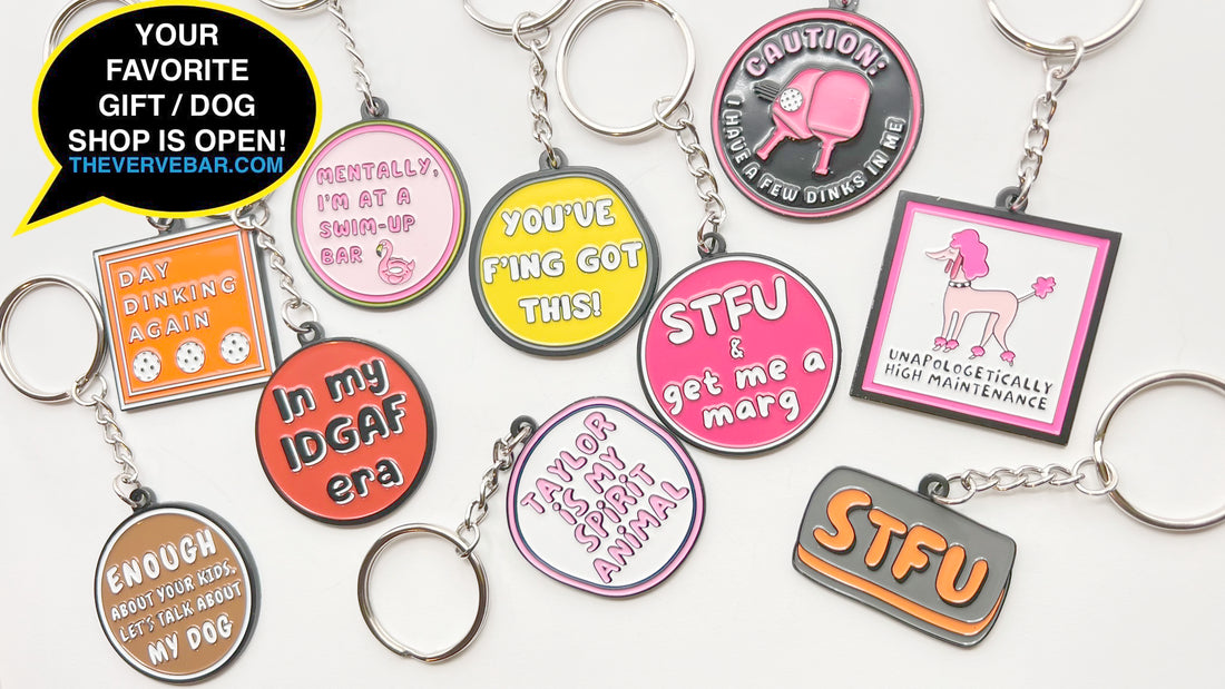 A sample of funny enamel keychains and a text bubble with "your new favorite gift / dog shop is open"
