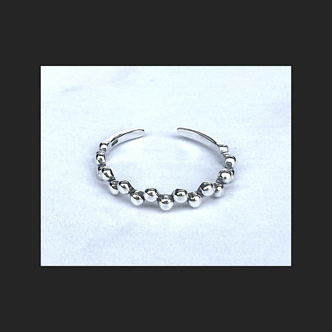 Delicate cute trendy silver stacking ring. Tiny balls on top and sides.