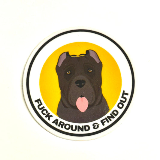 round cane corso dog sticker. Dark gray dog with yellow and white background "fuck around and find out"
