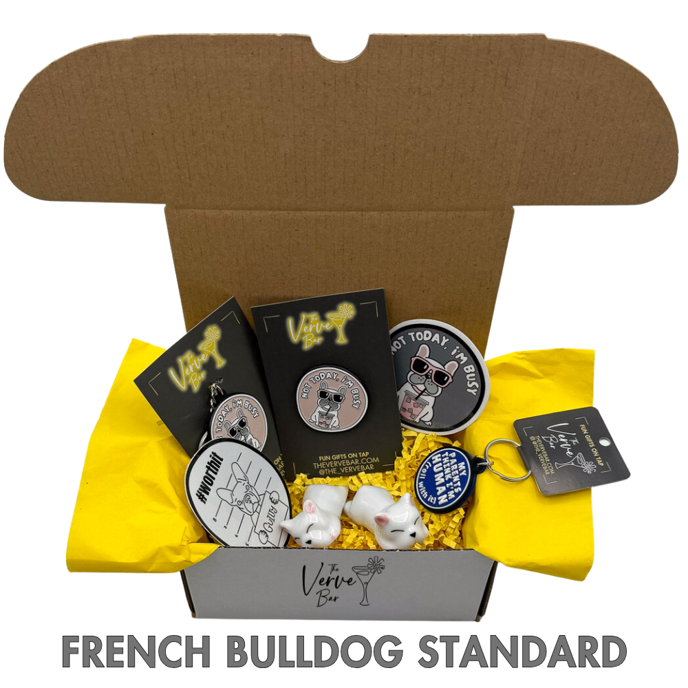 Collection of French Bulldog-themed items including pins and a plush toy in a box labeled 'French Bulldog Standard'.