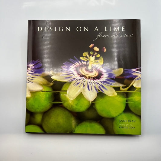 Hardcover, coffee table, book with a flower arrangement of limes and Pasion flowers on the cover. ￼