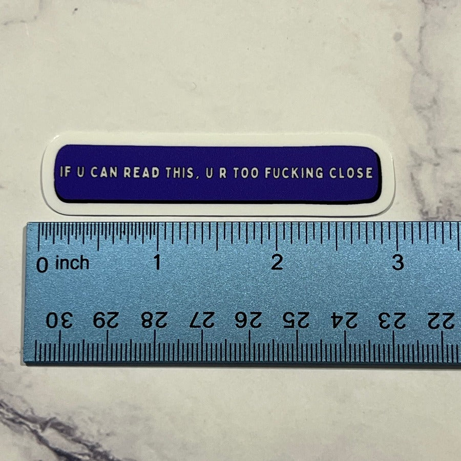 ruler showing the size of the sassy "get out of my bubble" sticker (just a hair under 3")