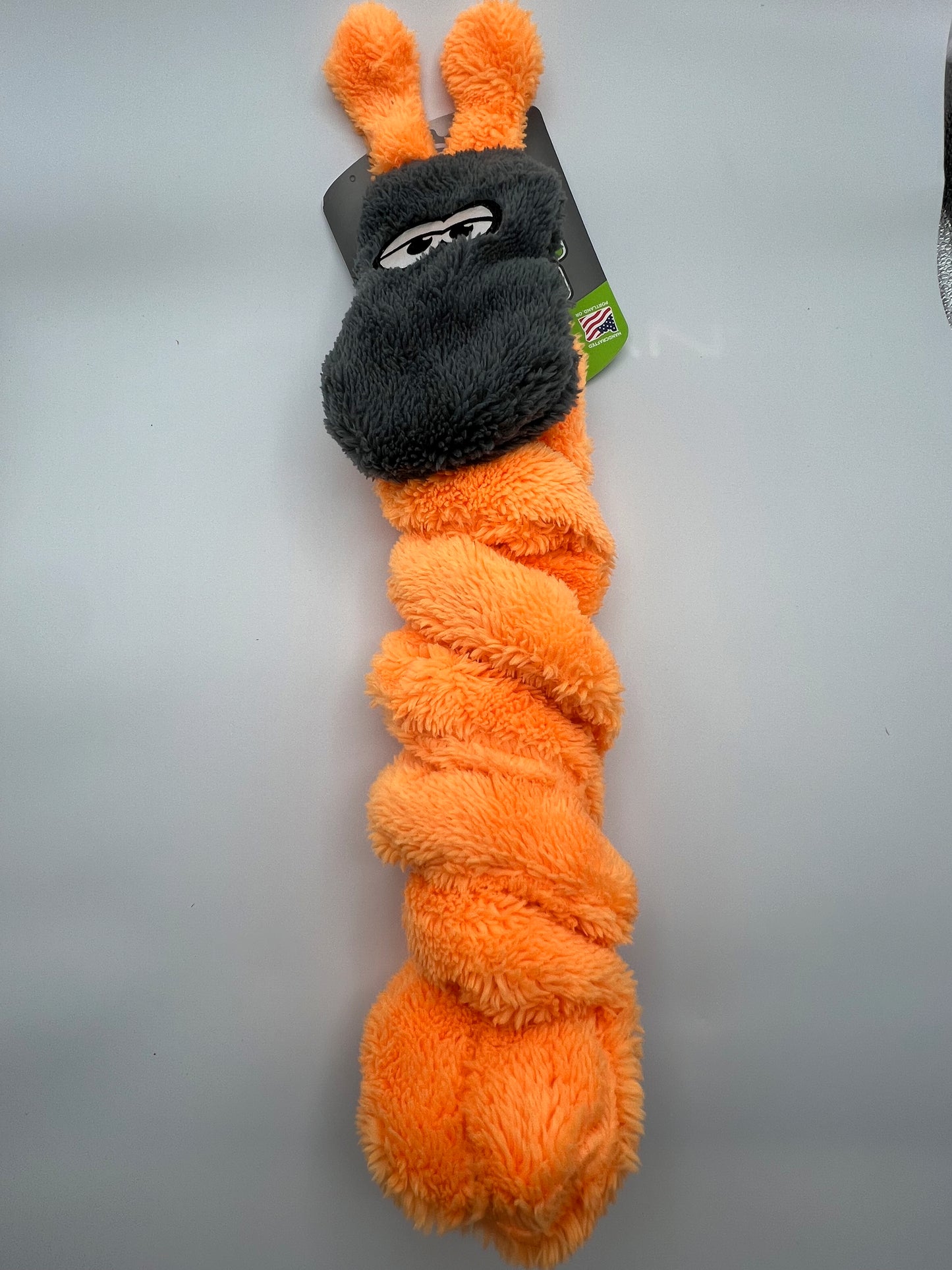 orange and gray soft plug caterpillar dog toy