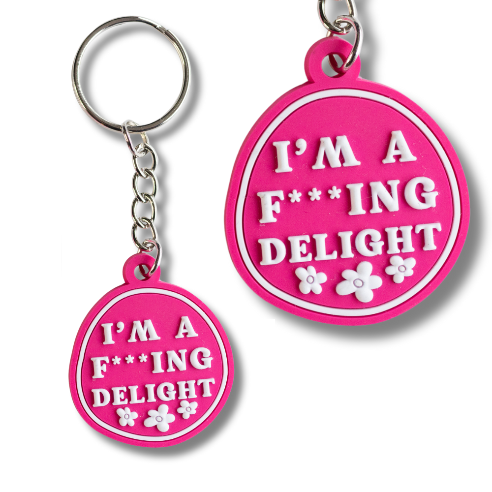 keychain: hot pink with raised white letters "I'm a f***ing delight" humorous keychain