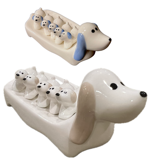 Dog chopstick rest set / big, one is khaki and white, and the other blue and white; each has a big dog with 5 mini dogs on it's back, each mini dog is a chopstick / knife rest.