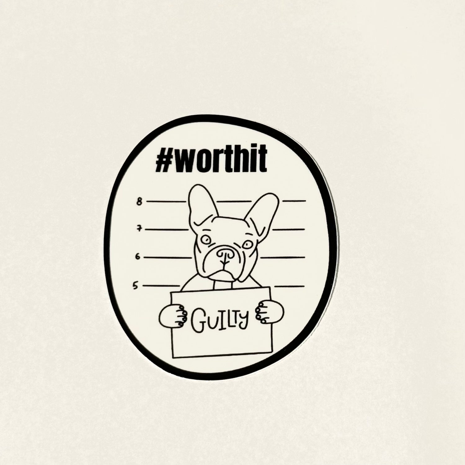 line art of french bulldog holding a suspect line-up sign that says "GUILTY" - hashtag above says #worthit