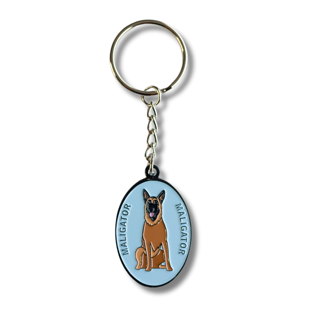 oval light blue keychain with  Belgian Malinois "Maligator" dog and text that says Maligator on each side of the dog