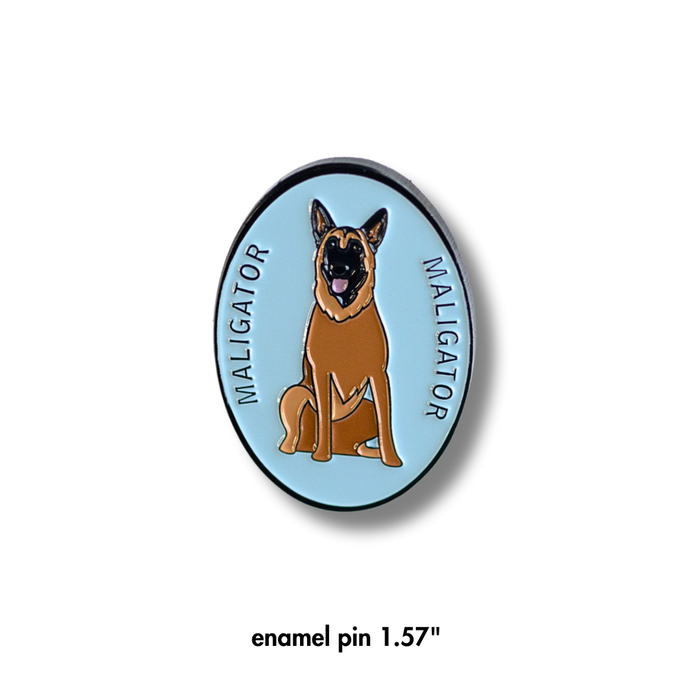 oval light blue enamel pin with Belgian Malinois "Maligator" dog and text that says Maligator on each side of the dog