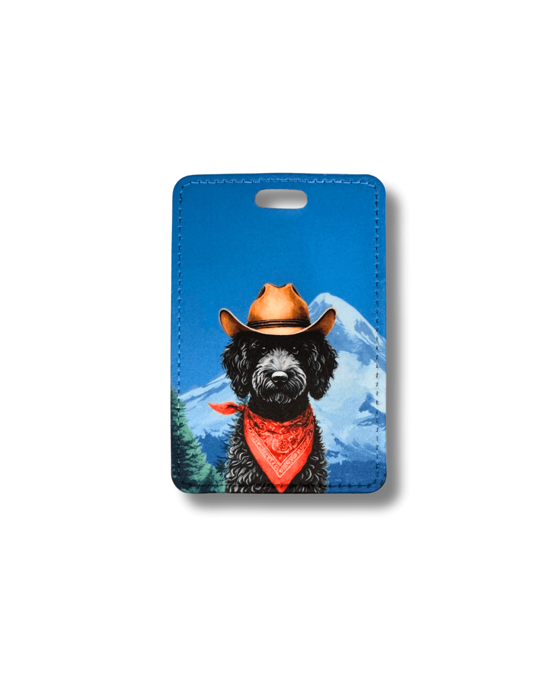 Luggage tag with a black labradoodle dog wearing a cowboy hat and bandana against a mountain background