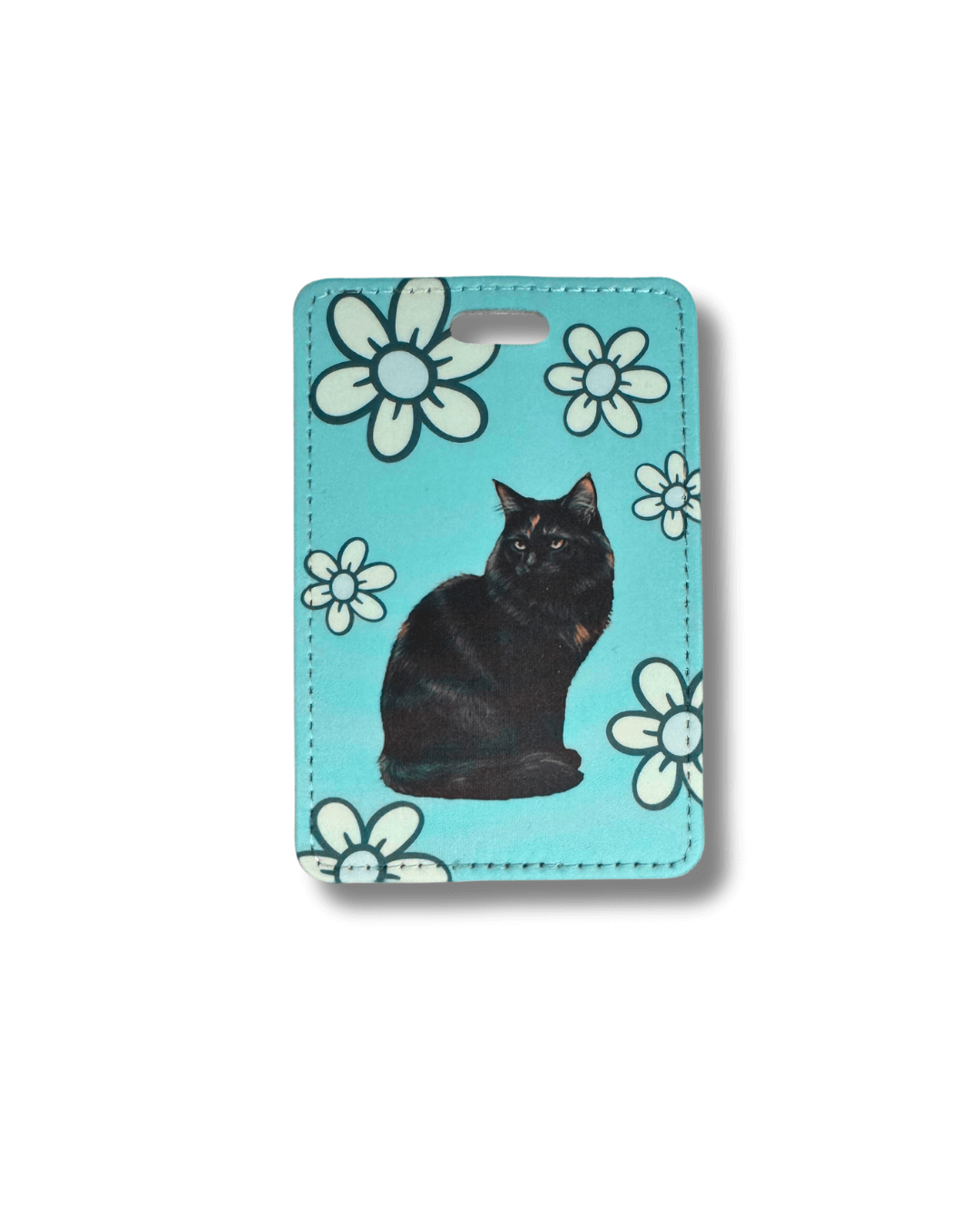 Luggage tag with black tortie cat and white flowers on a turquoise background
