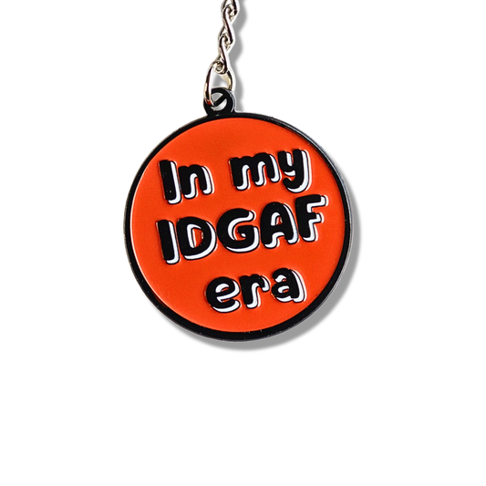 close up: Funny red enamel pin (circular): In my IDGAF era