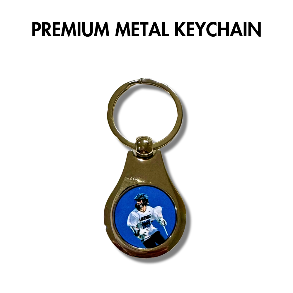 custom metal keychain with round photo of a lacrosse player. Blue background.