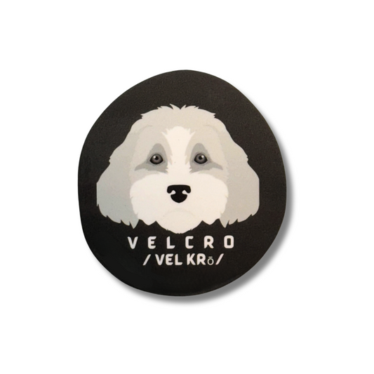 cute doodle dog round decal. Brown sticker with gray cartoon pup. Velcro spelled out with phoentics.