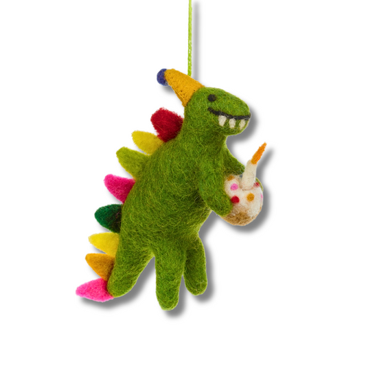 Green felt birthday dinosaur party decoration. Dino is holding a birthday cake with a felt candle. The dinosaur has colorful spikes on their back. 