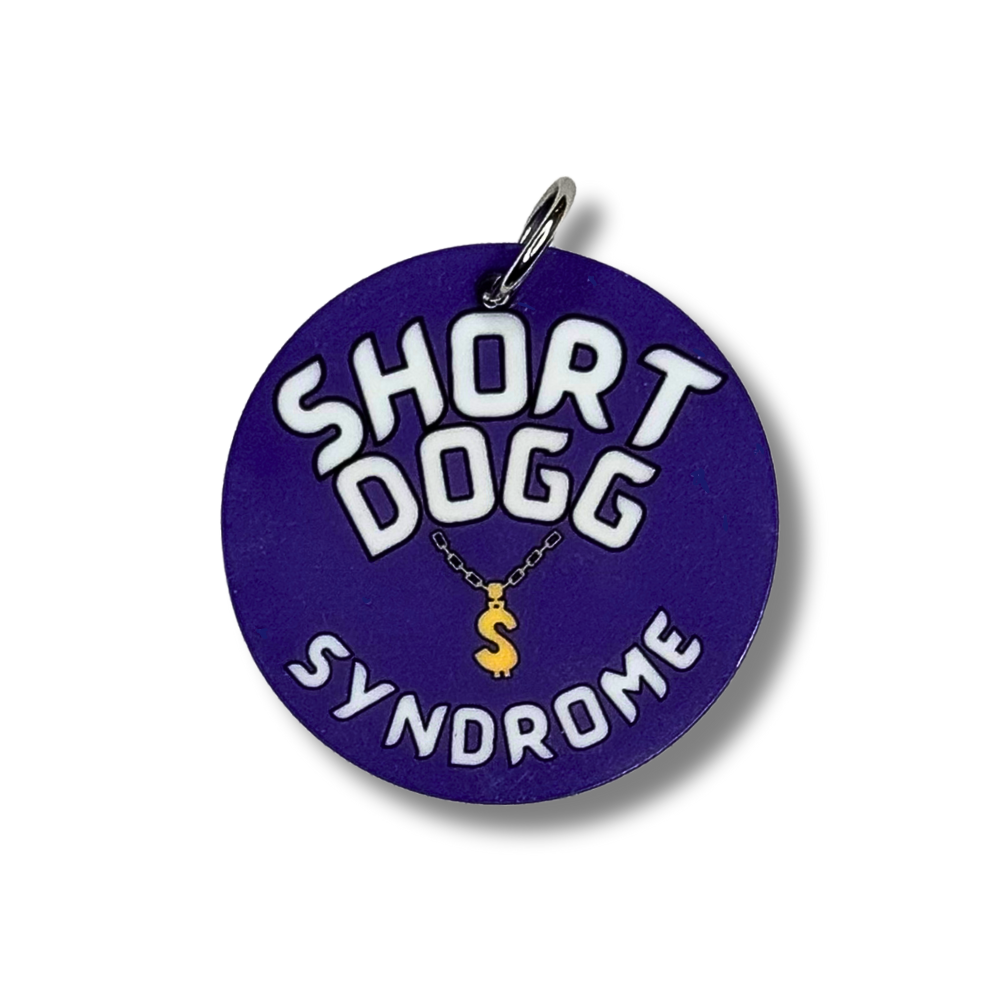 purple funny dog collar charm. It has image of a gold chain and says SHORT DOGG SYNDROME