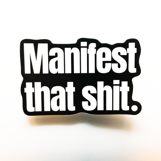 Large black sticker with bold font: Manifest That Shit