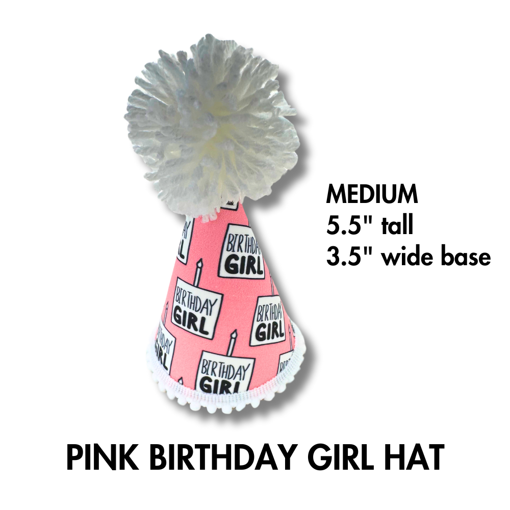 size medium info for: Dog birthday hat. Pink and white fabric that says "birthday girl" in black font. Large white pom on top.