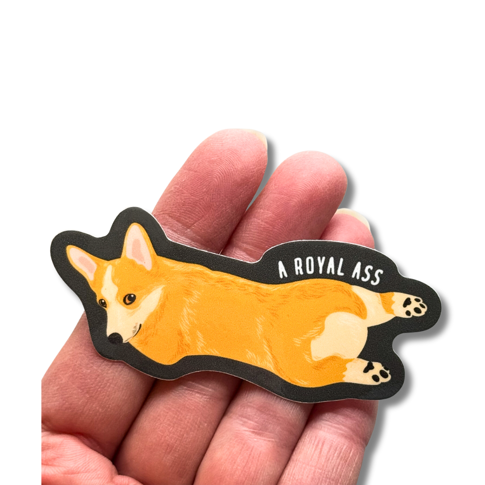 corgi decal in a hand to show size comparison 