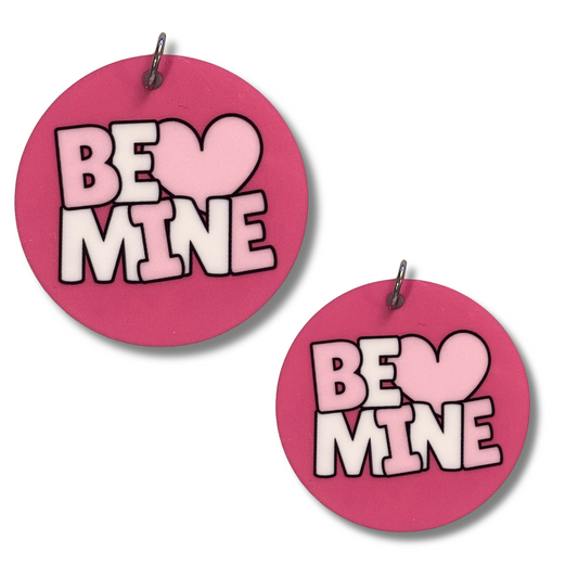 The cutest Valentine dog collar accessory - round pink acrylic collar charm with "Be Mine" design. Shown in 2 sizes for small, medium and large dogs.