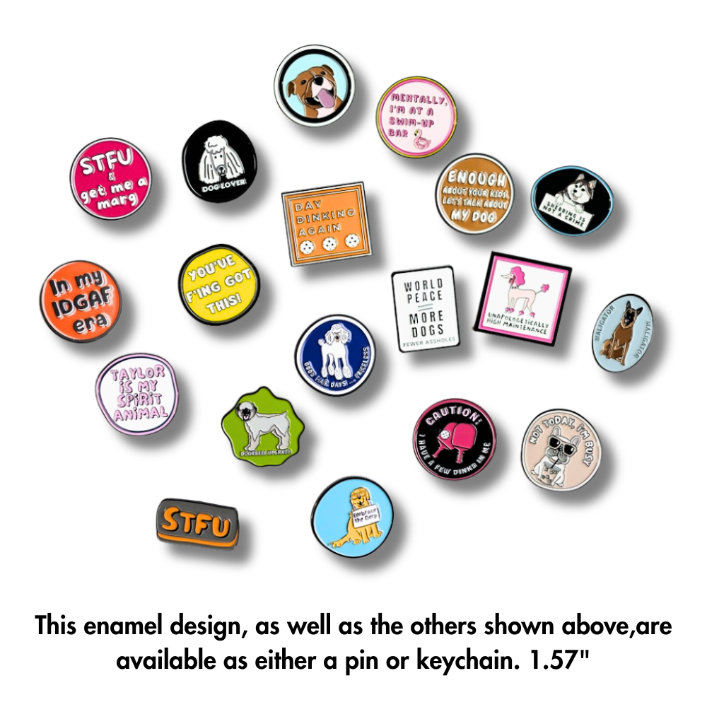 A photo of all 19 of our exclusive enamel pins and keychains; belgian malinois dog, happy pit bull, husky, french bulldog, wheaten terrier, golden retriever, poodle, pickleball, and more. Each one is 39 mm in diameter.