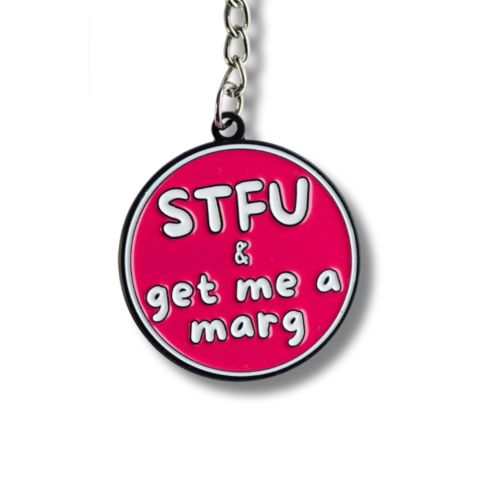 close up of hot pinkish-red sassy round enamel margarita keychain: STFU & get me a marg