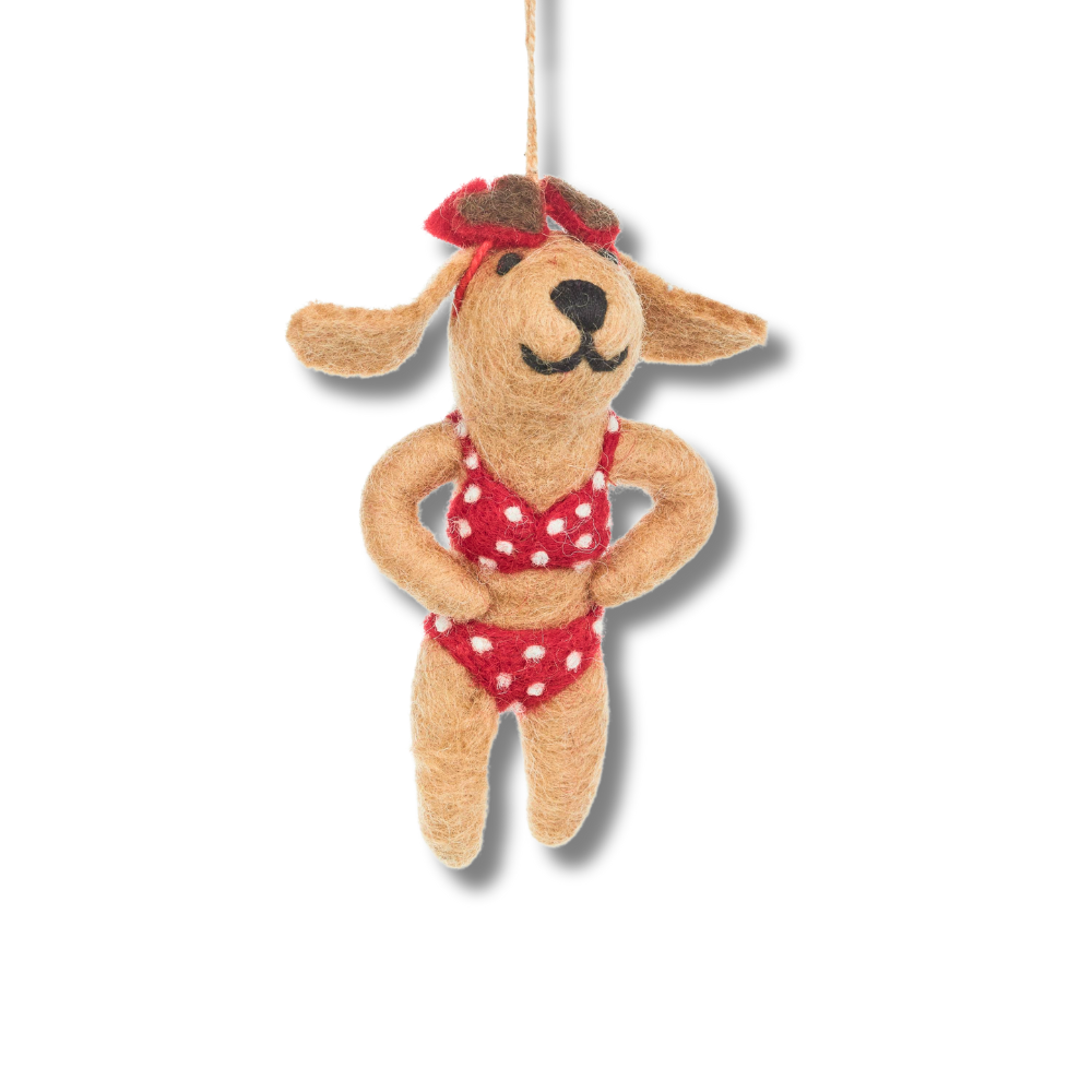 Felt dog ornament. The dog is wearing a red and white bikini and has red hear glasses on her head.