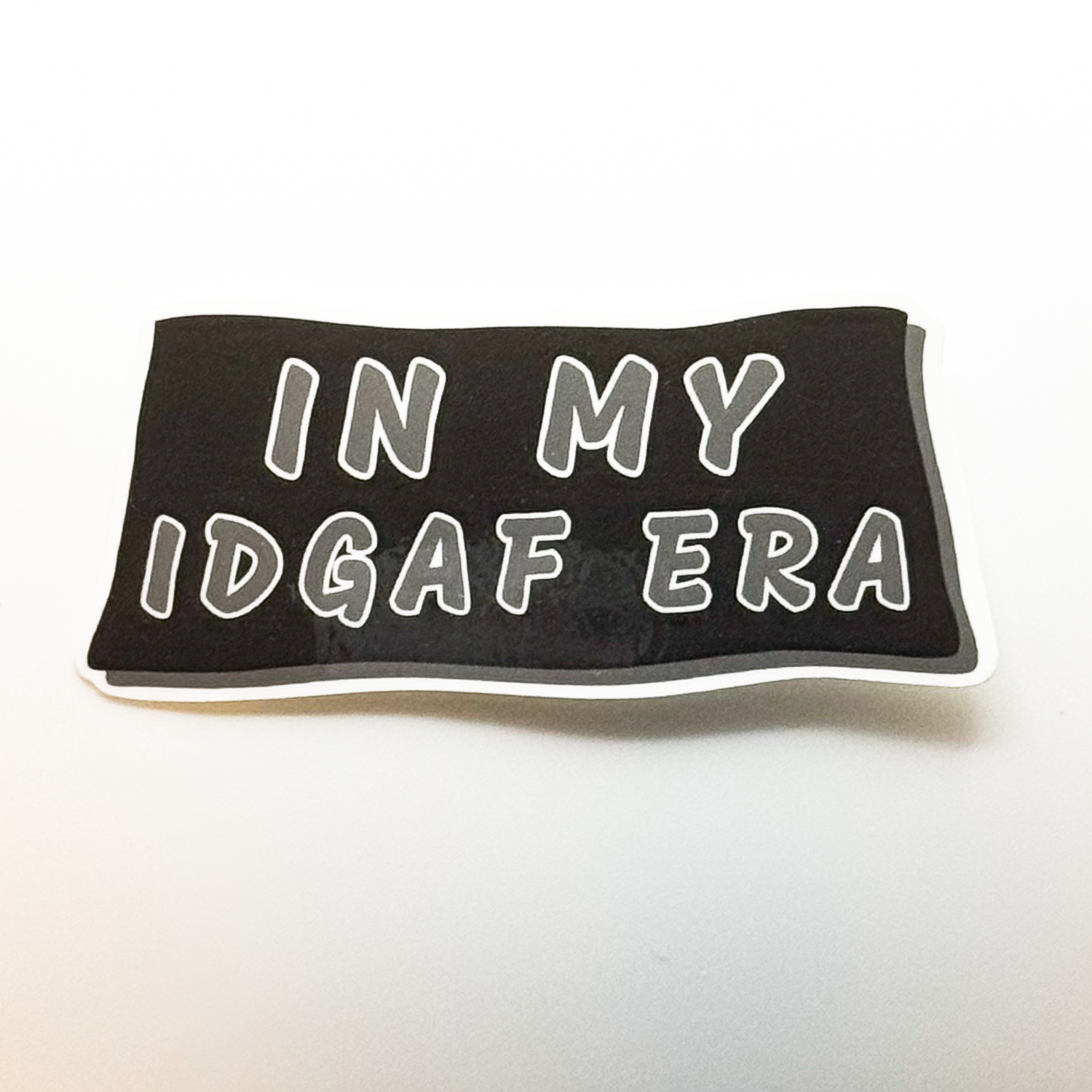 black rectangle sarcastic sticker "In my IDGAF era"
