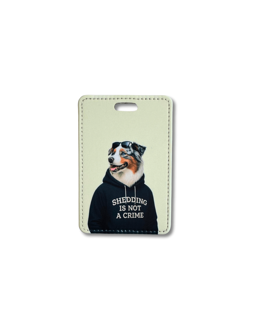 funny australian shepherd luggage tag; tricolor australian shepherd wearing a black hoodie that reads shedding is not a crime on a light background