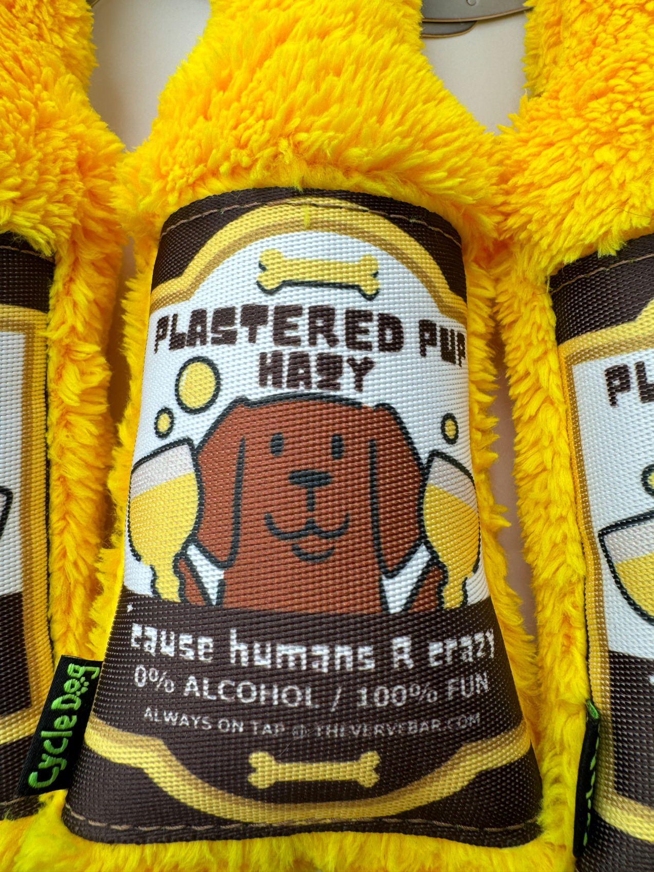 close up of label on dog beer bottle toy