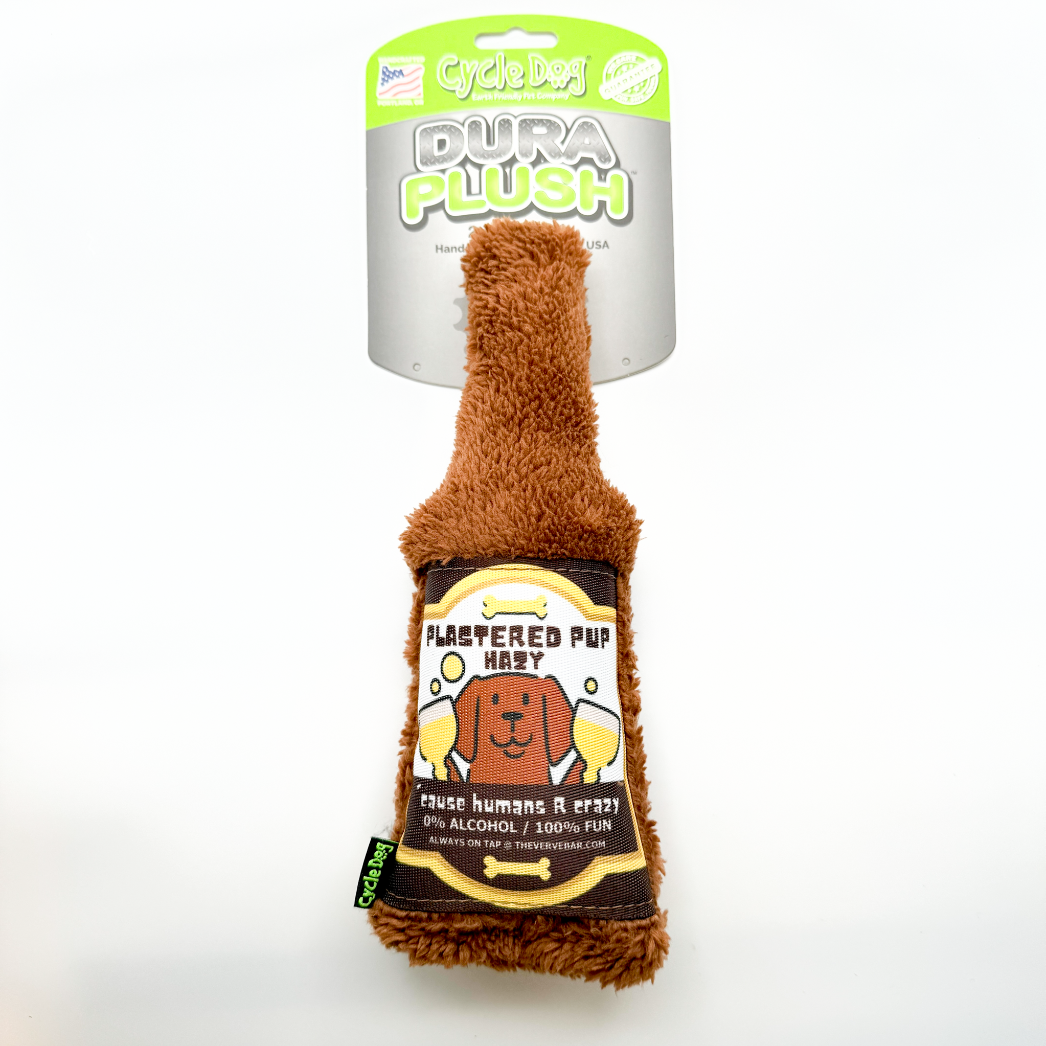 hilarious dog beer bottle toy; brown plush bottles with funny label of a dog holding two beers "plastered put hazy, 'cause humans are crazy"