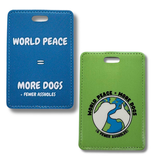 Images of two luggage tags that both say "World Peace = more dogs & fewer assholes" - one is deep blue with white letters, the other is green with a globe and two white dog silhouettes.