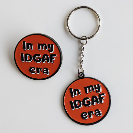 Red and black enamel pin and keychain: In my IDGAF era