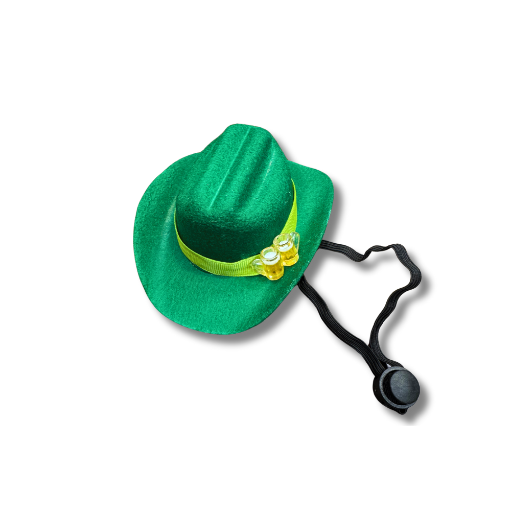 Green mini dog cowboy hat for St. Patrick's Day with a bright green accent ribbon and two mini mugs of been as decorations on the front-side. This image shows the adjustable strap so you can see how the hat stays on the pup's head